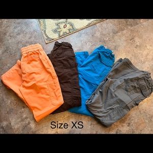 Name brand scrubs. Mostly Koi. Tops are all size small except for Navy blue.